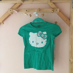 A hello kitty green shirt